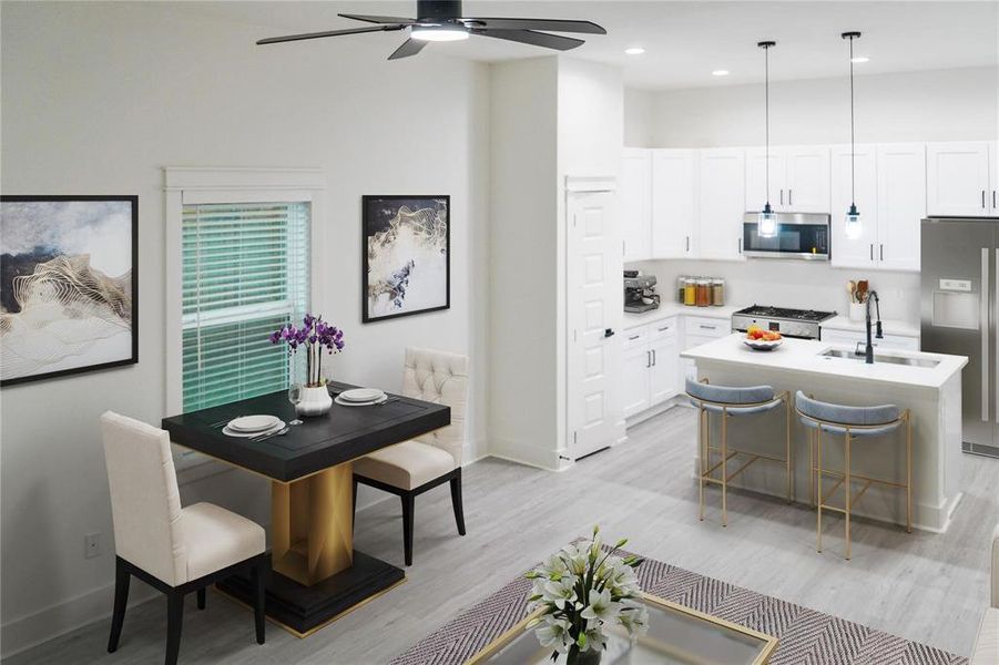 Dining area with light wood-style floors, recessed lighting, and ceiling fan