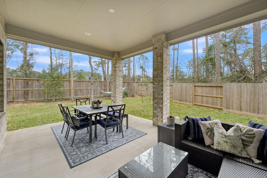 Extended covered back patio — a valuable builder upgrade — perfect for relaxing evenings and outdoor entertaining.