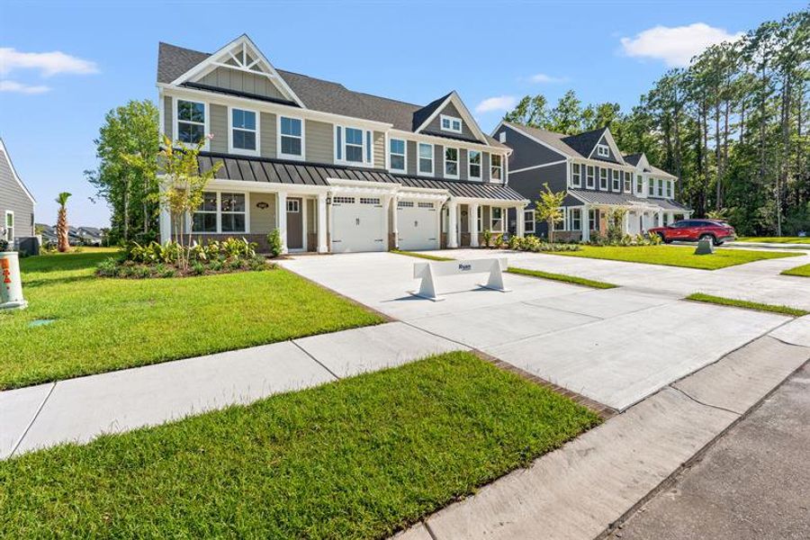 Front exterior of a new home in Grande Dunes North Village, Myrtle Beach, SC, highlighting curb appeal (Image 2).