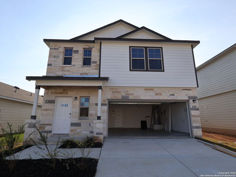 Front exterior of a new home in Park Place, New Braunfels, TX, highlighting curb appeal (Image 27).