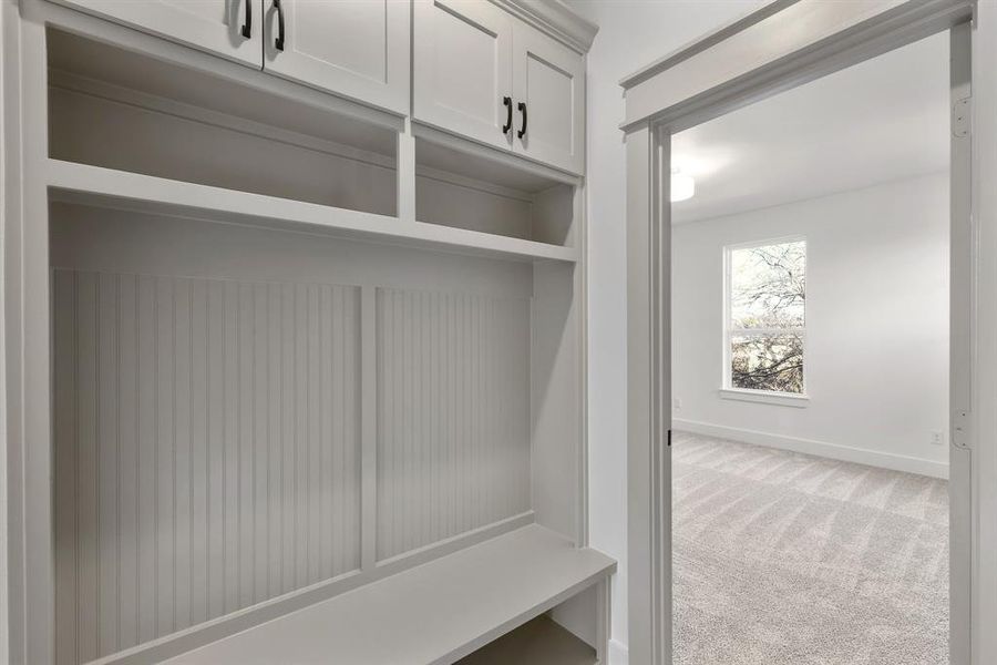 Mudroom with carpet floors