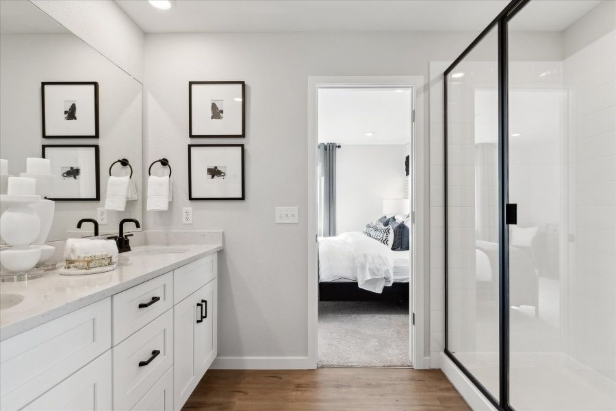 A bathroom with a glass shower. A bathroom with a glass shower.