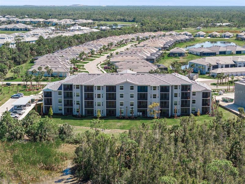 Front exterior of a new home in Heritage Landing: Veranda Condominiums, Punta Gorda, FL, highlighting curb appeal (Image 25).