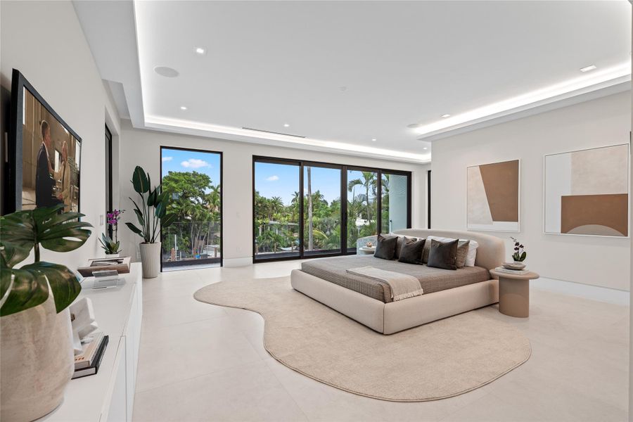 Expansive primary suite with floor-to-ceiling glass doors, waterfront views, and a sleek modern design with abundant natural light. Expansive primary suite with floor-to-ceiling glass doors, waterfront views, and a sleek modern design with abundant natural light.