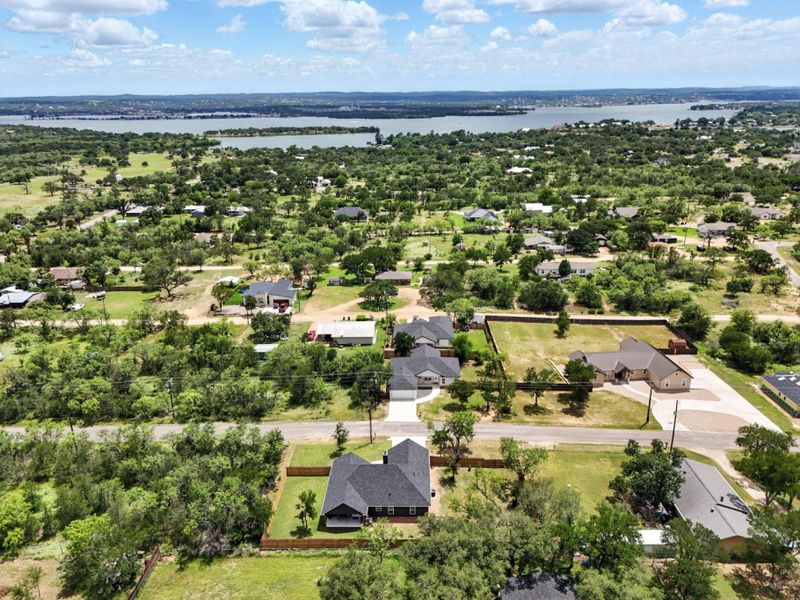 Aerial perspective of suburban area with a large body of water
