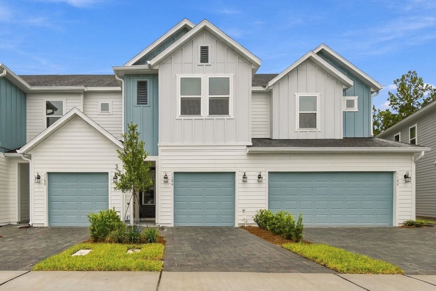 Front exterior of a new home in Preserve at The Cays – The Driftwood Series, Daytona Beach, FL, highlighting curb appeal (Image 1). Front exterior of a new home in Preserve at The Cays – The Driftwood Series, Daytona Beach, FL, highlighting curb appeal (Image 1).