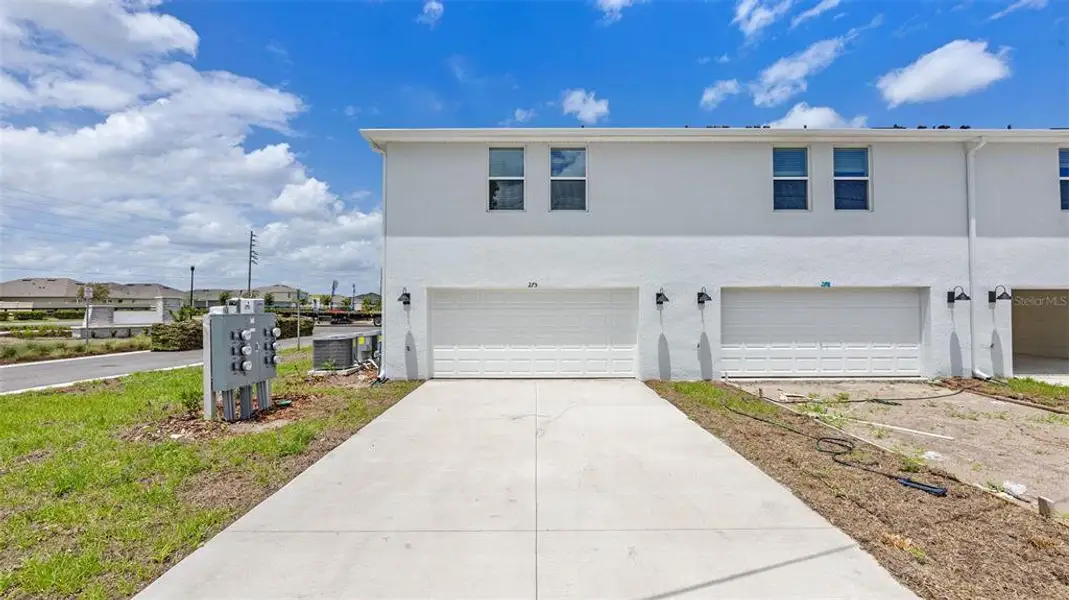 Front exterior of a new home in Evergreen Park, Kissimmee, FL, highlighting curb appeal (Image 1). Front exterior of a new home in Evergreen Park, Kissimmee, FL, highlighting curb appeal (Image 1).