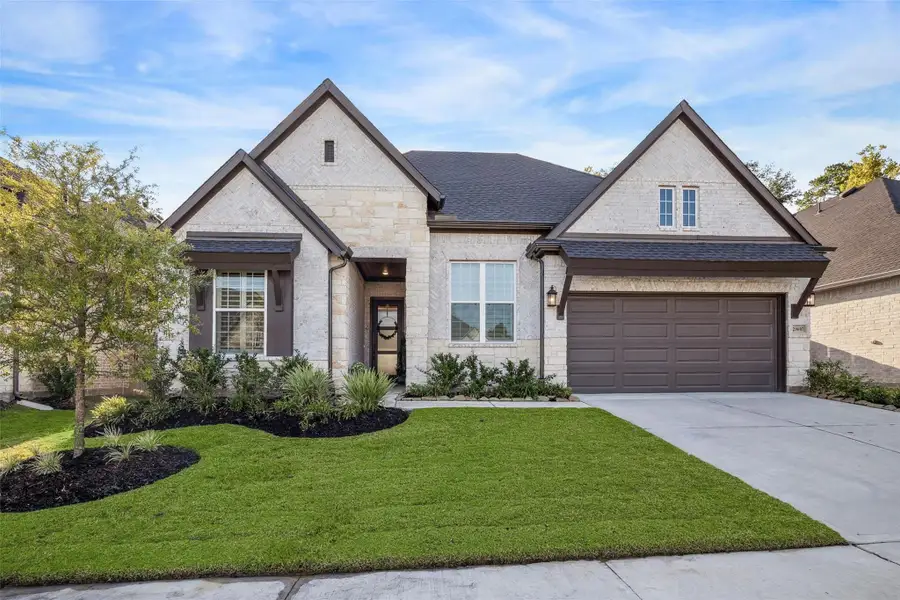 Front exterior of a new home in Pine Trails, Tomball, TX, highlighting curb appeal (Image 1). Front exterior of a new home in Pine Trails, Tomball, TX, highlighting curb appeal (Image 1).
