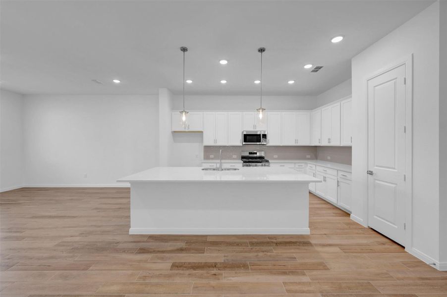 Furnished interior view inside a new home in Meridiana - Terrace Collection, Manvel (Image 4).