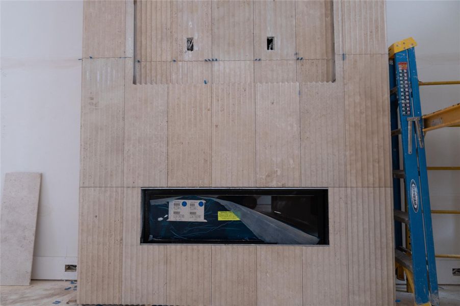 Living room fireplace tile. Progress as of 4/15/26.