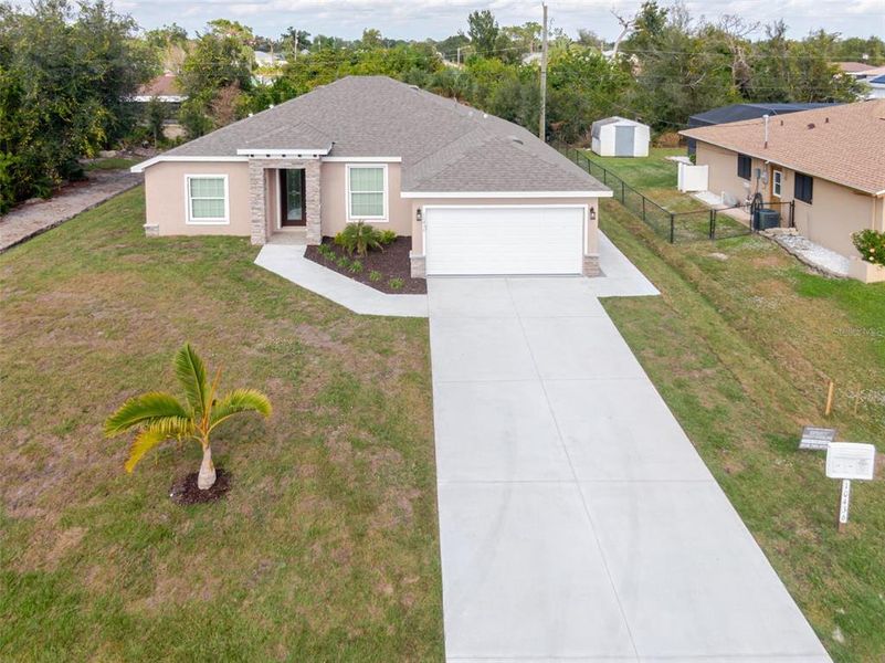 Front exterior of a new home in , Englewood, FL, highlighting curb appeal (Image 2). Front exterior of a new home in , Englewood, FL, highlighting curb appeal (Image 2).