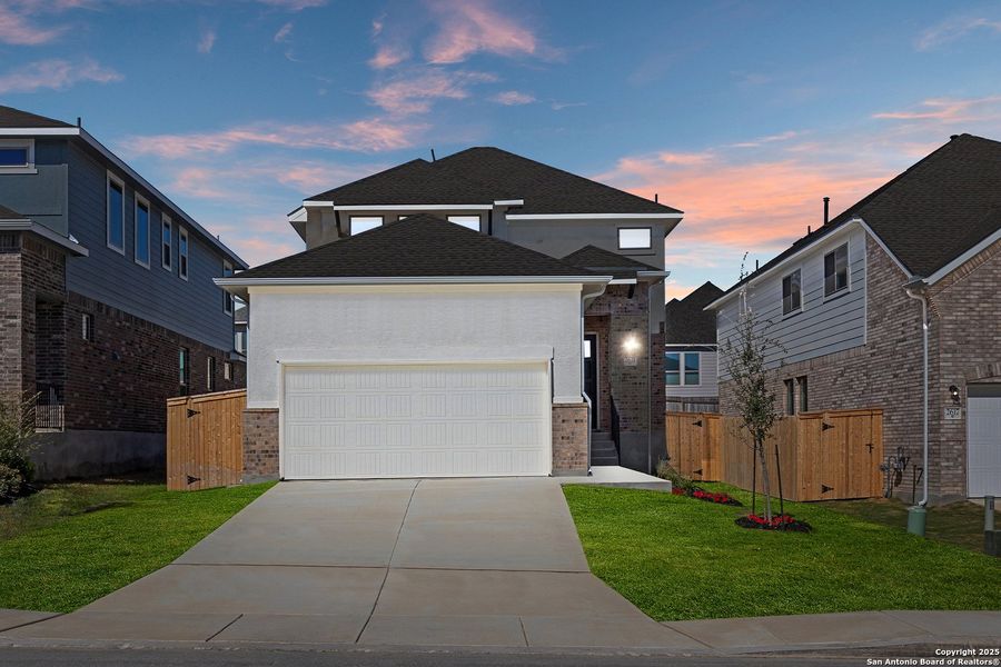 Front exterior of a new home in Ladera, San Antonio, TX, highlighting curb appeal (Image 14). Front exterior of a new home in Ladera, San Antonio, TX, highlighting curb appeal (Image 14).