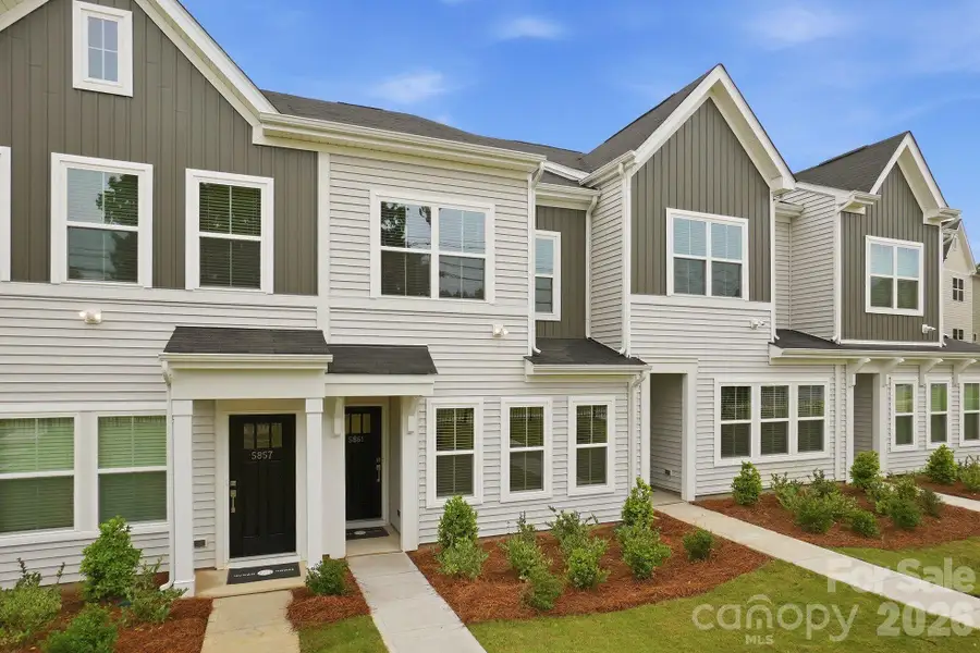 Front exterior of a new home in Sloan Station, Charlotte, NC, highlighting curb appeal (Image 25).