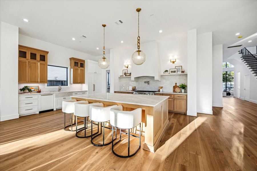 Expansive kitchen anchors the main living level with a generous island, abundant counter space, and clear sightlines to surrounding rooms. Designed for both daily use and entertaining, the layout supports multiple work zones without crowding or interruption. **Previous build by Arch Angelo** Expansive kitchen anchors the main living level with a generous island, abundant counter space, and clear sightlines to surrounding rooms. Designed for both daily use and entertaining, the layout supports multiple work zones without crowding or interruption. **Previous build by Arch Angelo**