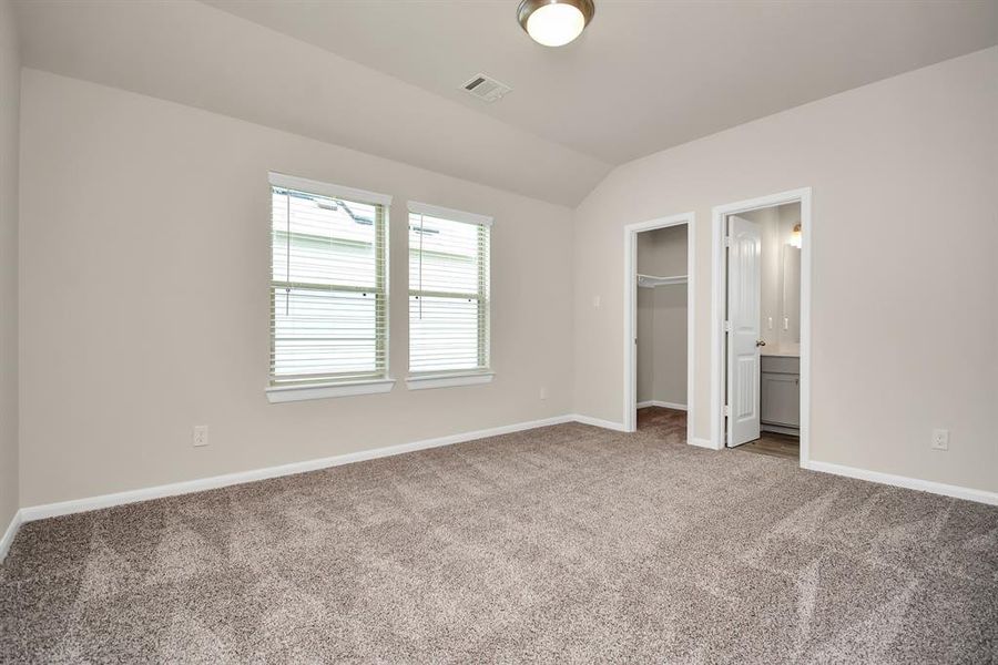 This third bedroom offers the perfect space to rest and recharge featuring high ceiling that creates a light and airy atmosphere. With plenty of space for a twin or full-size bed and a closet for storage, this room can easily adapt to changing needs. **This image is from another Saratoga Home with similar floor plan and finishes, not the Brittany floorplan.**