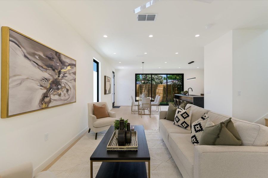 Living room with recessed lighting and baseboards
