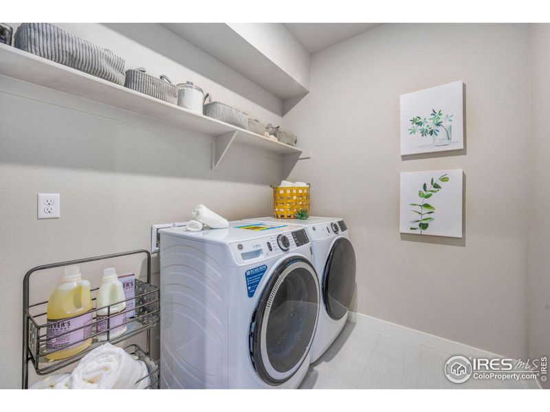 Full size laundry room on upper floor near bedrooms