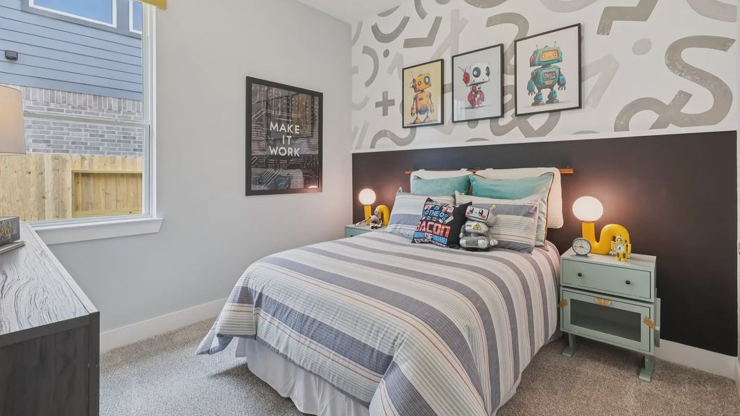 Representative furnished interior of a home built from the Adele by Chesmar Homes in Sunterra, Katy (Image 25).