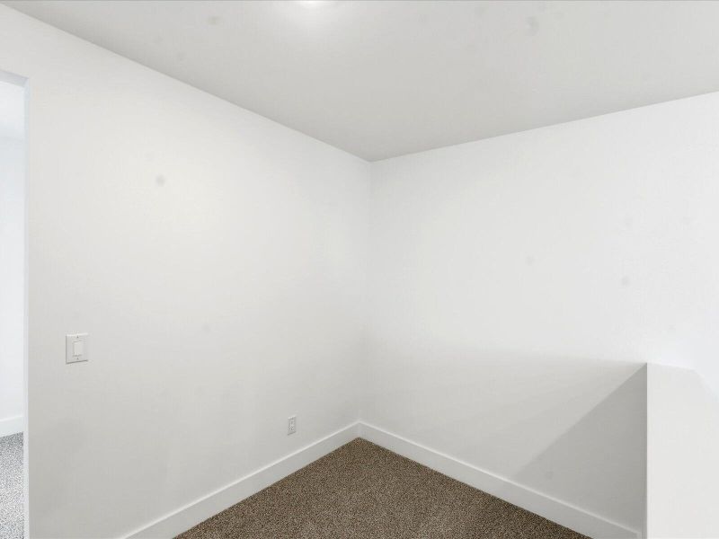 Spacious, unfurnished interior of a new home in The Coves at Lakes of Cane Bay II, Summerville (Image 40).