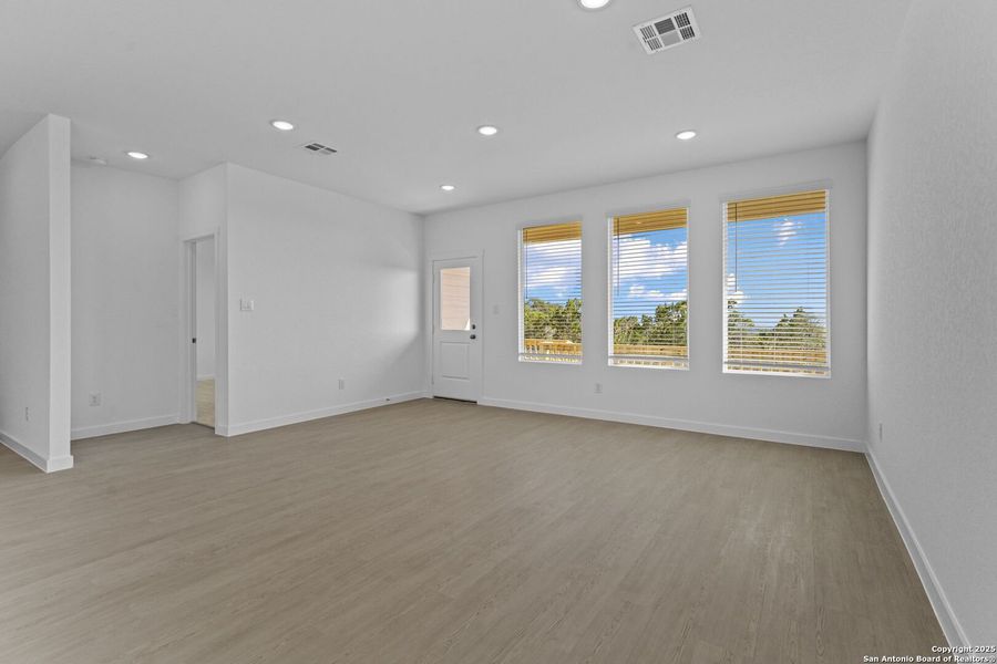 Spacious, unfurnished interior of a new home in Waterwheel: Coastline Collection, San Antonio (Image 18).