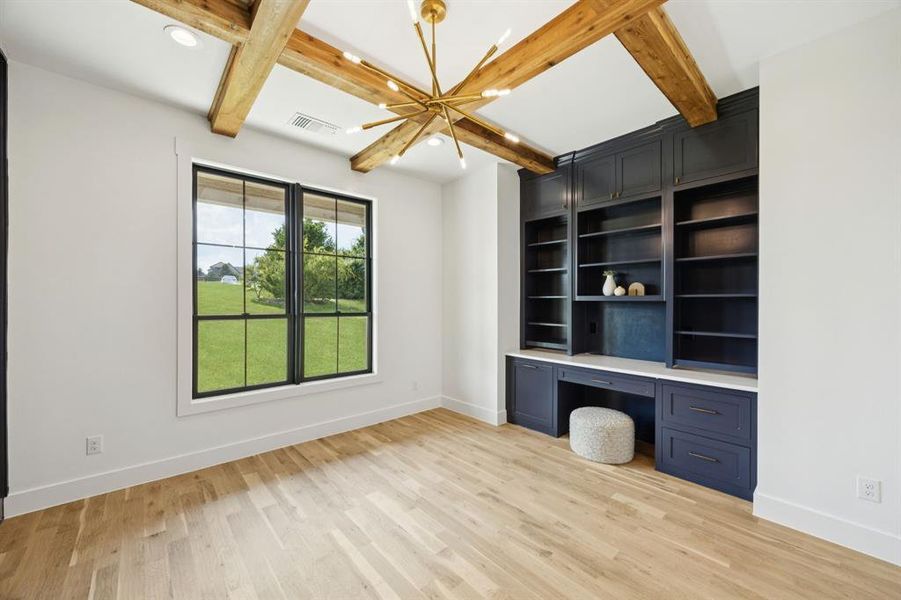 Custom built-ins and beamed ceilings are stand-outs in the study. Custom built-ins and beamed ceilings are stand-outs in the study.