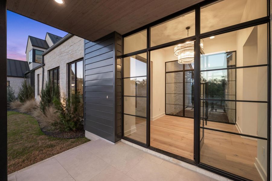 View of exterior entry with metal roof and a standing seam roof View of exterior entry with metal roof and a standing seam roof