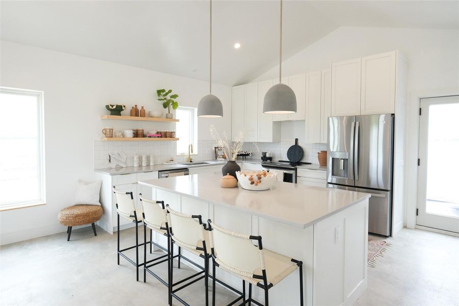 Open Concept Floorplan, with vaulted ceilings, flooded with natural light. Offering minimalistic yet high-end finishes through out the entire Hacienda.