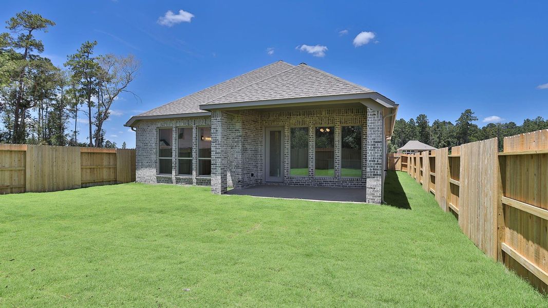 Front exterior of a new home in Artavia 45', Conroe, TX, highlighting curb appeal (Image 2). Front exterior of a new home in Artavia 45', Conroe, TX, highlighting curb appeal (Image 2).