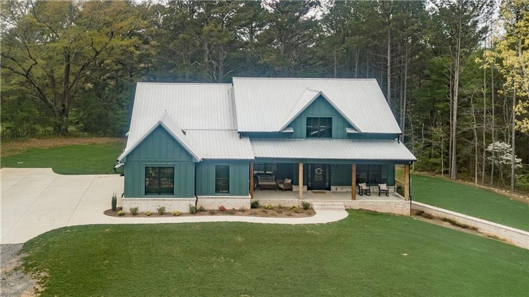 Front exterior of a new home in , Silver Creek, GA, highlighting curb appeal (Image 2). Front exterior of a new home in , Silver Creek, GA, highlighting curb appeal (Image 2).