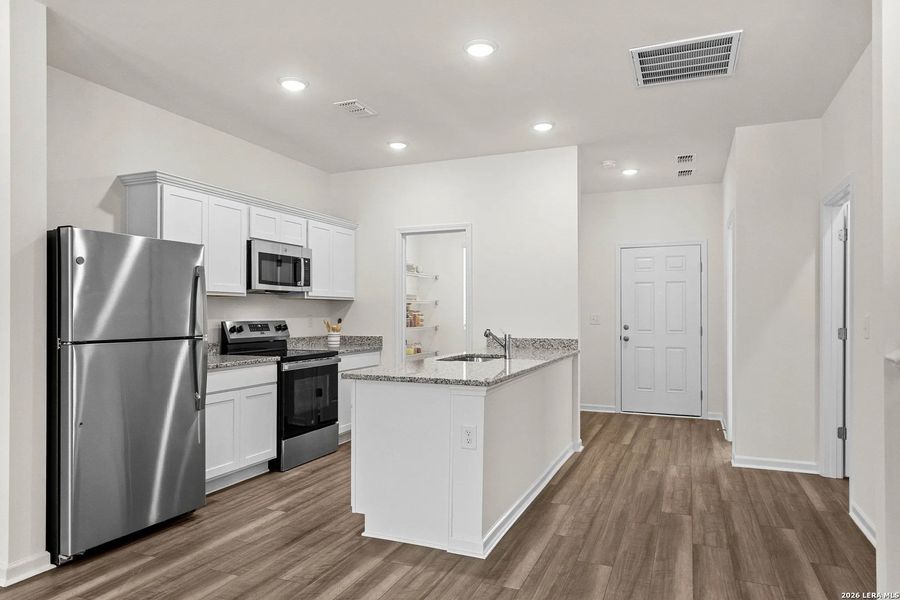 Furnished interior view inside a new home in Sutton Farms, San Antonio (Image 10).