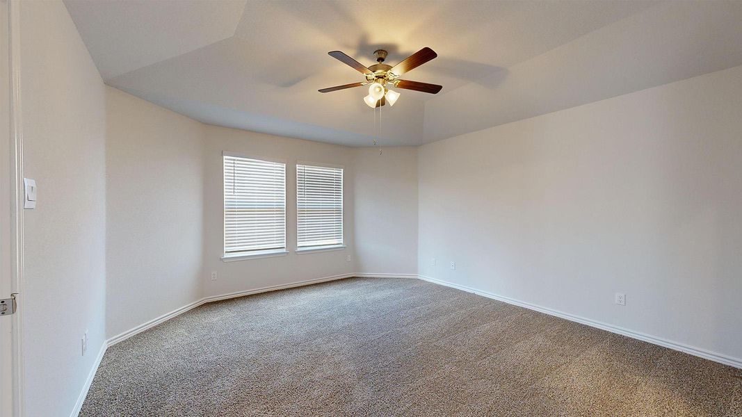 Spare room with light carpet and ceiling fan Spare room with light carpet and ceiling fan
