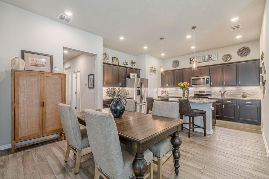 Dining space featuring light wood finished floors
