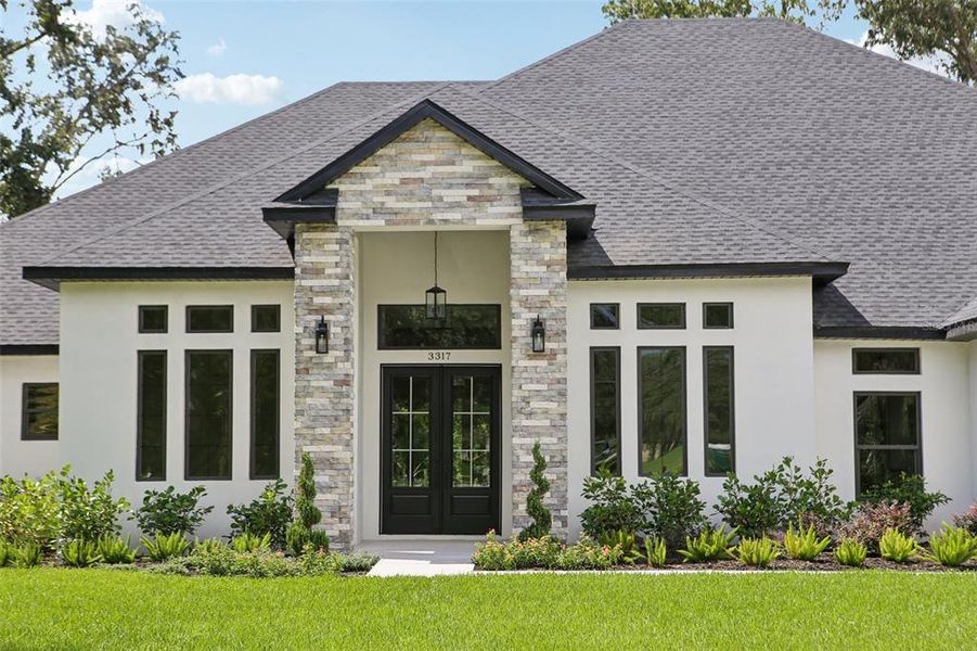 Front exterior of a new home in , Lutz, FL, highlighting curb appeal (Image 29).