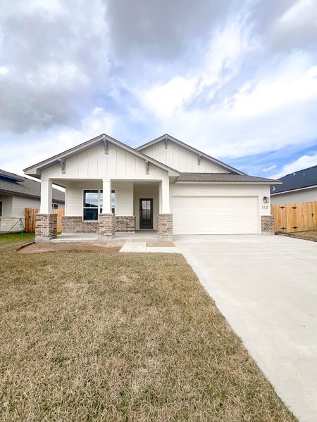 Front exterior of a new home in TerraVista, Victoria, TX, highlighting curb appeal (Image 20).