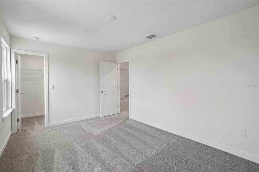 Spacious, unfurnished interior of a new home in Grasslands West, Lakeland (Image 40).