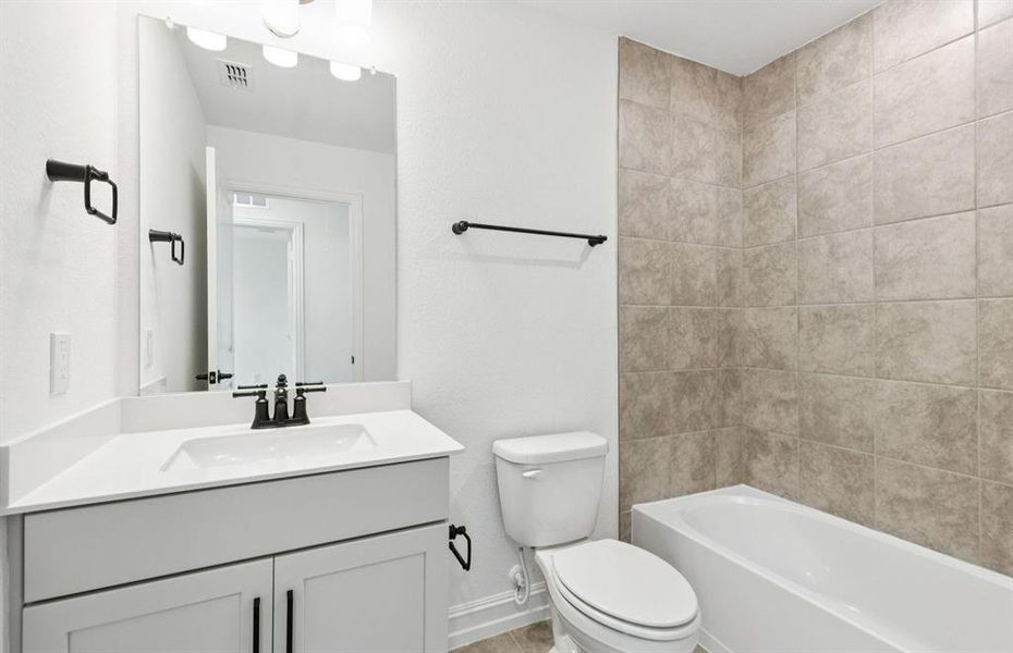 Upgraded secondary bath with elegant finishes  *Real home pictured