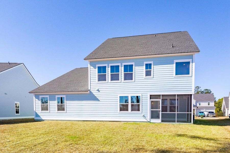 Front exterior of a new home in Waterside at Lakes of Cane Bay: Coastal Collection, Summerville, SC, highlighting curb appeal (Image 13).