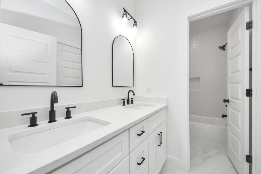 Full bathroom with contemporary fixtures and finishes. Full bathroom with contemporary fixtures and finishes.