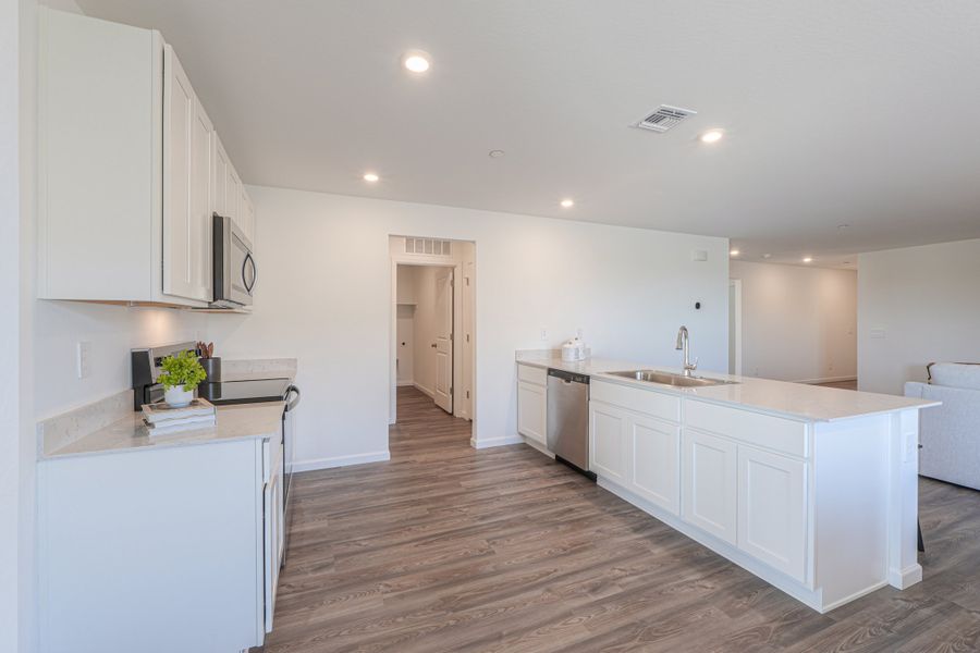 A kitchen with white cabinets. A kitchen with white cabinets.