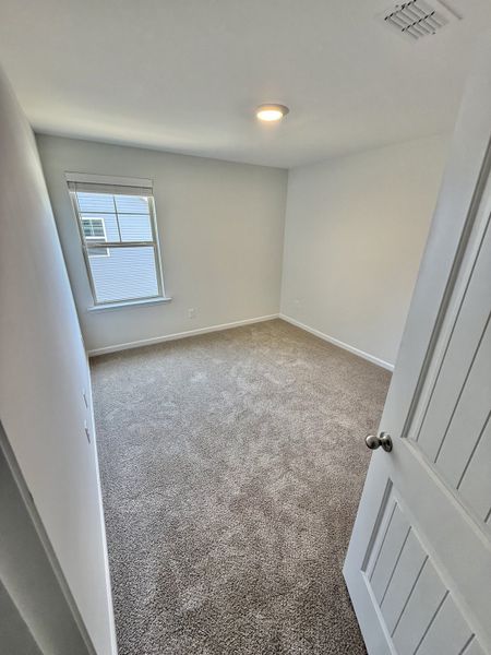 Spacious, unfurnished interior of a new home in Stone Fort Meadows, Manchester (Image 10).