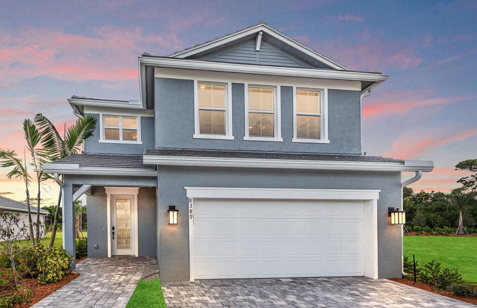 Front exterior of a new home in Harbor Isle, Vero Beach, FL, highlighting curb appeal (Image 1). Front exterior of a new home in Harbor Isle, Vero Beach, FL, highlighting curb appeal (Image 1).