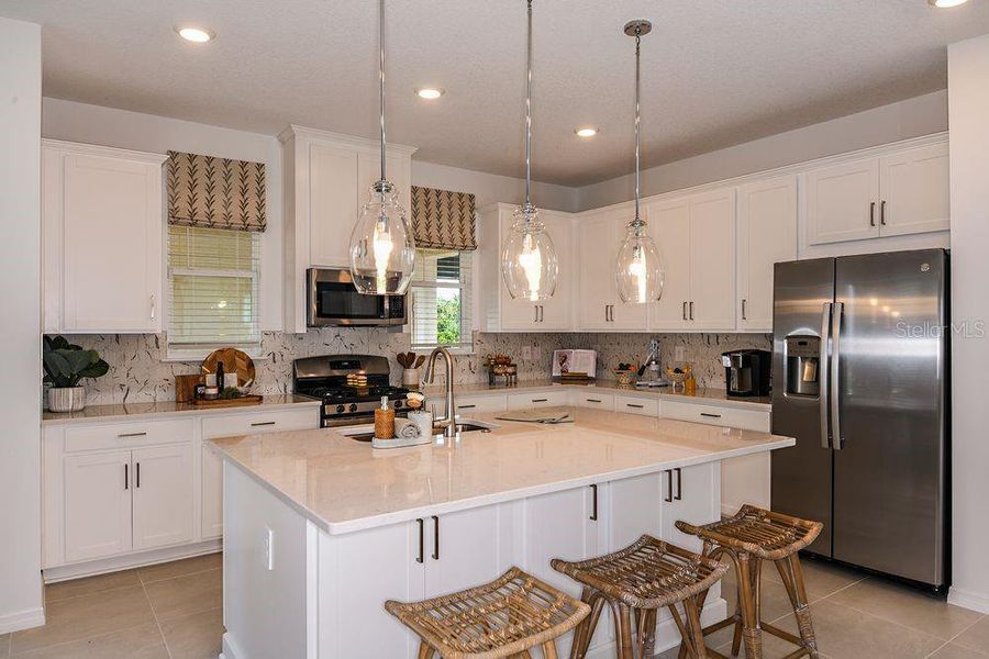 Furnished interior view inside a new home in Harvest at Ovation, Winter Garden (Image 29).