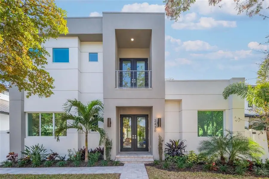 Front exterior of a new home in , Sarasota, FL, highlighting curb appeal (Image 1).