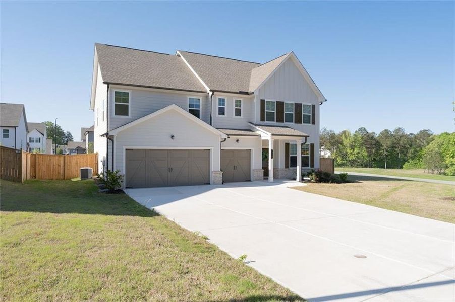 Front exterior of a new home in , Dallas, GA, highlighting curb appeal (Image 28).