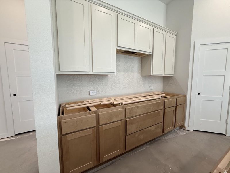 Beautiful two tone cabinets. Pardon our mess, still under construction.