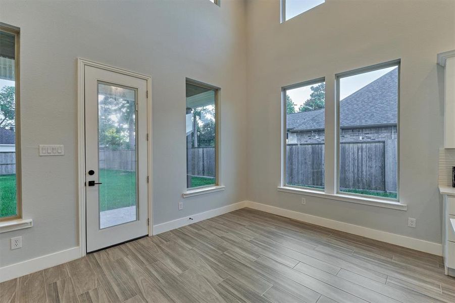 Breakfast area overlooks the back and side yard.