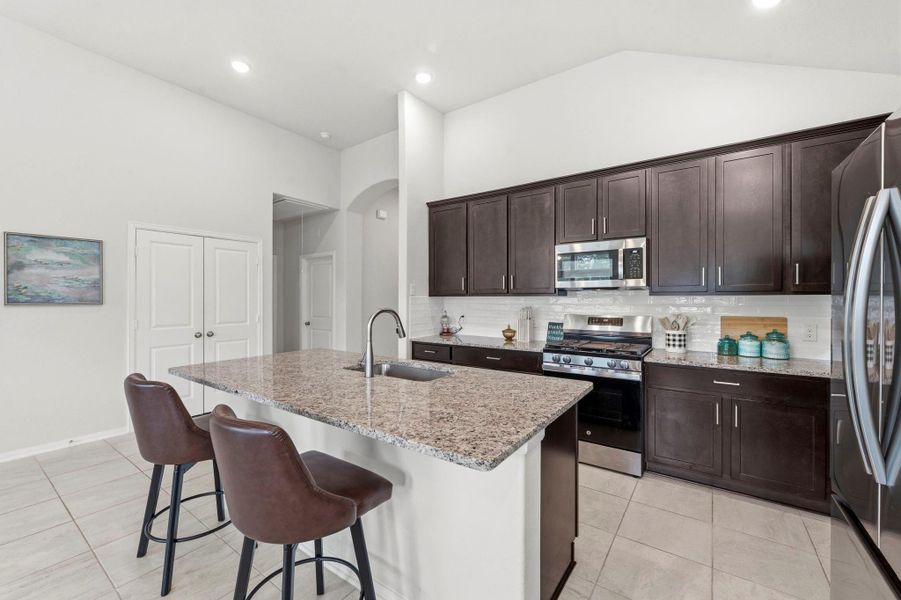 This oversized island was made for casual breakfasts, entertaining guests, and everyday convenience. This oversized island was made for casual breakfasts, entertaining guests, and everyday convenience.