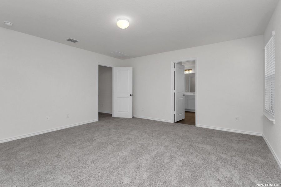 Spacious, unfurnished interior of a new home in Preserve at Culebra - Heritage Collection, San Antonio (Image 19).