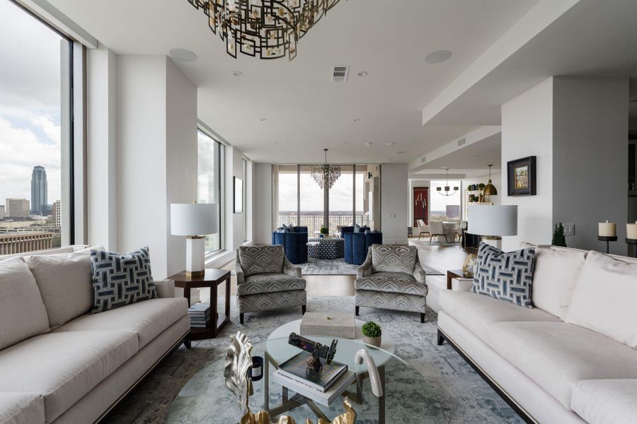 This photo showcases the spacious, open living area with large windows offering stunning city views. Bright and inviting, this space is ideal for relaxation or entertaining. This photo showcases the spacious, open living area with large windows offering stunning city views. Bright and inviting, this space is ideal for relaxation or entertaining.