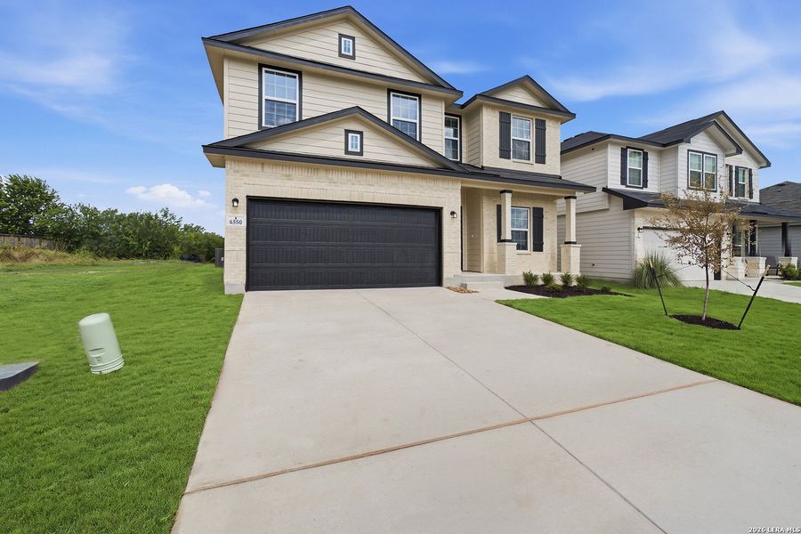 Front exterior of a new home in Morgan Meadows, San Antonio, TX, highlighting curb appeal (Image 2).